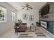 Comfortable living space with stylish decor, a ceiling fan, and a view of the yard at 8328 Berringer Bluff, North Charleston, SC 29418