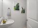 Stylish powder room featuring modern fixtures, decorative art, and fresh decor at 8328 Berringer Bluff, North Charleston, SC 29418