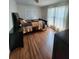 Comfortable bedroom with hardwood floors, neutral decor, and ample closet space at 867 Colony Dr # F 118, Charleston, SC 29407