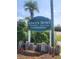 Attractive community signage for River's Bend Condominiums, beautifully landscaped with lush greenery at 867 Colony Dr # F 118, Charleston, SC 29407