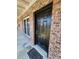 Elegant exterior with black front door, brick facade, and classic window details at 867 Colony Dr # F 118, Charleston, SC 29407