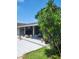 Inviting outdoor patio space with tile flooring and an American flag, perfect for relaxation and entertaining at 867 Colony Dr # F 118, Charleston, SC 29407