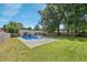 Expansive backyard showcasing an in-ground pool, patio area, and well-maintained lawn at 8767 Auburn Dr, North Charleston, SC 29406