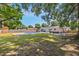 Spacious backyard with a pool, fencing, and ample green space, perfect for outdoor enjoyment at 8767 Auburn Dr, North Charleston, SC 29406