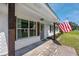 Charming brick home featuring dark wood accents and shutters, with a welcoming front entrance at 8767 Auburn Dr, North Charleston, SC 29406