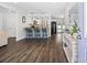 Open-concept kitchen featuring a breakfast bar, modern appliances, and seamless transition to living areas at 8767 Auburn Dr, North Charleston, SC 29406