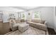 Comfortable living room featuring neutral tones, plush seating, and natural light at 8767 Auburn Dr, North Charleston, SC 29406