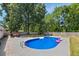 Backyard with an inviting in-ground pool and a spacious patio area, perfect for outdoor relaxation at 8767 Auburn Dr, North Charleston, SC 29406