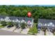 Aerial view of a residential community with well-maintained homes, driveways, and lush green trees at 9079 Parlor Dr, Ladson, SC 29456