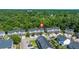 Aerial view of townhome community with lush trees, lawns, and neighborhood streets at 9079 Parlor Dr, Ladson, SC 29456