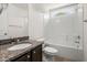 Bathroom with shower-tub combo and granite vanity, bright and clean with crisp white paint at 9079 Parlor Dr, Ladson, SC 29456