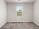 Bedroom featuring neutral carpeting, a window with blinds, and neutral paint at 9079 Parlor Dr, Ladson, SC 29456