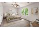 Comfortable bedroom with big window and neutral-colored carpet at 9079 Parlor Dr, Ladson, SC 29456