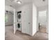 Upstairs hallway includes laundry closet and bathroom access at 9079 Parlor Dr, Ladson, SC 29456