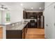 Modern kitchen featuring granite countertops, stainless steel appliances, and dark wood cabinets at 9079 Parlor Dr, Ladson, SC 29456