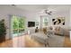 Open-concept living room with sliding door access to the outdoors at 9079 Parlor Dr, Ladson, SC 29456