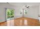 Spacious room with hardwood floors, natural light, and sliding glass doors at 9079 Parlor Dr, Ladson, SC 29456
