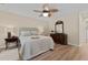 Bedroom with dresser, bed, nightstand, ceiling fan and hardwood flooring at 9091 Delancey Cir, North Charleston, SC 29406