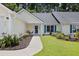 Well-maintained home featuring manicured landscaping, a walkway, and charming exterior details at 9091 Delancey Cir, North Charleston, SC 29406