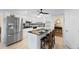 Bright kitchen featuring granite countertops, island with seating, and stainless steel appliances at 9091 Delancey Cir, North Charleston, SC 29406