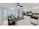 Open-concept kitchen with island seating and a bay window breakfast nook, great for entertaining at 9091 Delancey Cir, North Charleston, SC 29406