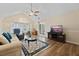 Spacious living room with vaulted ceiling, bay window, and stylish decor at 9091 Delancey Cir, North Charleston, SC 29406