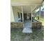 A covered back porch of the house with table at 980 Margaret Dr, Ladson, SC 29456
