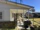 Cozy back porch with outdoor seating; ideal for relaxing and enjoying the backyard at 980 Margaret Dr, Ladson, SC 29456
