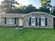Charming brick home with a yellow front door and black shutters; perfect for curb appeal at 980 Margaret Dr, Ladson, SC 29456