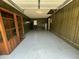 An empty garage, with wooden paneling on the walls at 980 Margaret Dr, Ladson, SC 29456