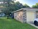 Side view of brick home with detached garage and driveway; ample parking space at 980 Margaret Dr, Ladson, SC 29456