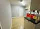 Kitchen with white cabinets, red base cabinets, and a serving bar at 980 Margaret Dr, Ladson, SC 29456