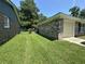 A lush side yard with a brick house and garage at 980 Margaret Dr, Ladson, SC 29456