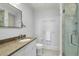 Bathroom with marble countertops, modern fixtures, and glass shower at 1 King # 702, Charleston, SC 29401
