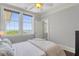 Bedroom with natural light, neutral walls, a ceiling fan, views of the water, and a cozy bed with plush bedding at 1 King # 702, Charleston, SC 29401