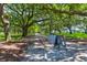 Beautiful community park offering lush greenery, mature trees, and shaded walking paths at 1 King # 702, Charleston, SC 29401