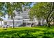 Beautiful multi-story building with lush landscaping and ample parking for residents and guests at 1 King # 702, Charleston, SC 29401