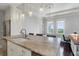 Kitchen with granite countertops, stainless steel appliances, and views of the ocean at 1 King # 702, Charleston, SC 29401