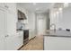 Bright kitchen featuring stainless appliances, stone backsplash, granite counters, and ample cabinet space at 1 King # 702, Charleston, SC 29401