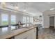 Open kitchen flowing into the living room, with granite countertops and stainless steel appliances at 1 King # 702, Charleston, SC 29401