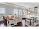 Comfortable living room with custom built-ins, hardwood floors, and plenty of natural light at 1 King # 702, Charleston, SC 29401