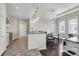 Open-concept living space with modern kitchen, dining area, and living room at 1 King # 702, Charleston, SC 29401