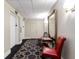 Lobby featuring a decorative mirror and seating area, an artistic rug, and doors to two elevators at 1 King # 702, Charleston, SC 29401