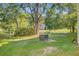 Lush backyard featuring mature trees, pond, and greenery offering a tranquil outdoor space at 1001 Waterwood Dr, Goose Creek, SC 29445