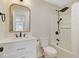 Updated bathroom with white vanity, black fixtures, and shower-tub combo at 1001 Waterwood Dr, Goose Creek, SC 29445