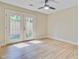 Bright bedroom with modern ceiling fan and a door to the outdoor patio at 1001 Waterwood Dr, Goose Creek, SC 29445