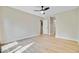 Open bedroom featuring neutral paint, wood floors, and closet with a ceiling fan at 1001 Waterwood Dr, Goose Creek, SC 29445
