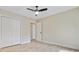 Bedroom features a ceiling fan, closet, and doorway to the hallway at 1001 Waterwood Dr, Goose Creek, SC 29445