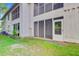Exterior of the building with a screened-in porch and a view of the surrounding grassy area at 1001 Waterwood Dr, Goose Creek, SC 29445