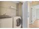 Laundry room featuring a washer, dryer, and storage shelves at 1001 Waterwood Dr, Goose Creek, SC 29445